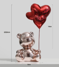 A bear with a heart-pink